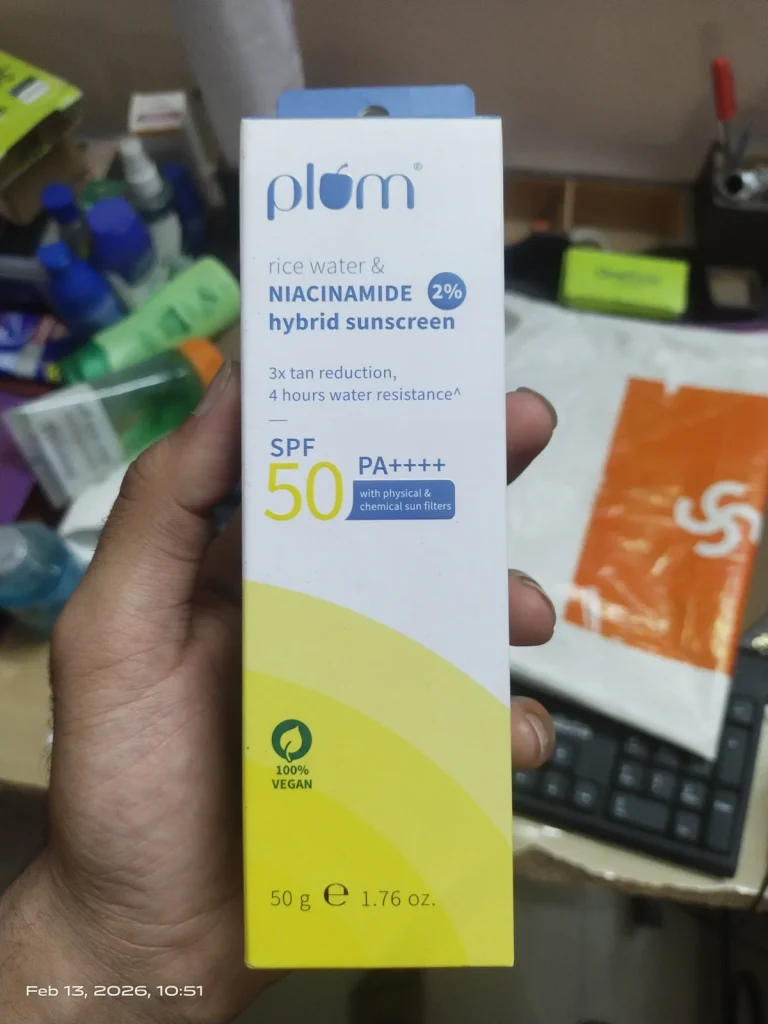 Plum Rice Water & Niacinamide 2% Hybrid Sunscreen SPF 50 PA++++ outer carton, 50 g, held in a shop